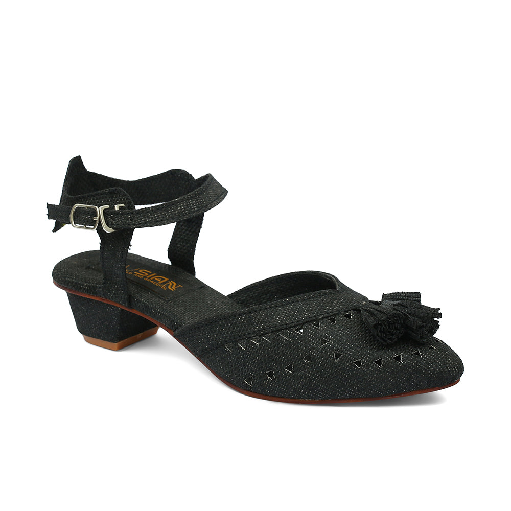 A black sandal with a jute upper and a back strap, featuring a buckle closure and a low heel.